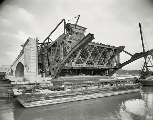 Construction of the Memorial Bridge in 1931-The control rooms are in the central pier of the bridge, parly below the water line of the river.  They are reached by a stairway leading down from the bridge surface.  Photo courtesy of the Library of VA photographic archive.